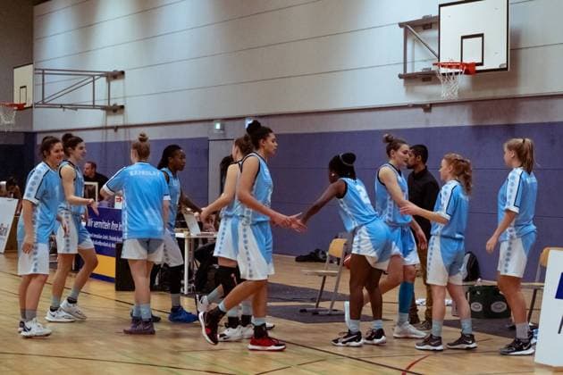 BERGISCH GLADBACH, GERMANY, DEC 2nd Capitol Bascats celebrate after winning the game in the Toyota-DBBL-Cup game between the Rheinland Lions and the Capitol Bascats Düsseldorf at Schulzentrum Herkenrath, Bergisch Gladbach, Germany. T. HERZBERG Rheinland Lions vCapitol Bascats Düsseldorf 