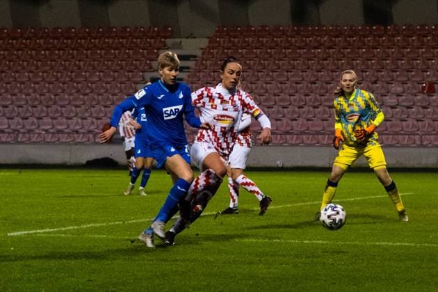 COLOGNE, GERMANY, DEC 6TH Paulina Krumbiegel ( 15 TSG) and Peggy Kuznik ( 21 FcKöln) battle for the ball during the DFB Pokal round of 16 between 1. Fc Köln and TSG Hoffenheim at the Franz-Kremer Stadion in Cologne. Tatjana Herzberg SPP 1. Fc Köln vs TSG Hoffenheim 