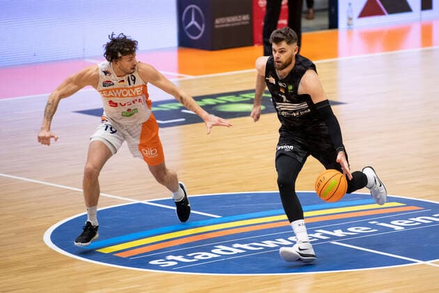 BARMER 2 Basketball Bundesliga ProA 11 Matchday Season 2020 2021 on 13 12 2020 Science City Jena vs ROSTOCK SEAWOLVES from right Julius Wolf Jena on the ball against Sid Marlon Theis Rostock Sparkassen Arena Jena