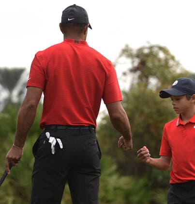 December 20, 2020, Orlando, Florida, United States: Tiger Woods fist bumps with his son Charlie on the third hole during the final round at the PNC Championship golf tournament at the Ritz-Carlton Golf Club. Orlando United States - ZUMAs197 20201220_zaa_s197_144 Copyright: xPaulxHennessyx