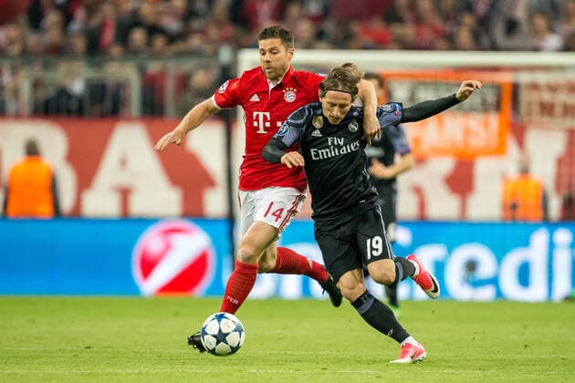 Munich, Germany 12 April 2017 CL 16 17 FC Bayern Muenchen vs Real Madrid v li in duel Xabi Alonso Muenchen and Luka Modric Madrid CL 16 17 FC Bayern Muenchen vs Real Madrid sjak