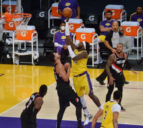Los Angeles Lakers Montrezi Harrell scores over Portland Trail Blazers Enes Kanter during the second half at Staples Center in Los Angeles on Monday, December 28, 2020. The Trail Blazers defeated the Lakers 115-107.  LAP2020122805 JIMxRUYMEN