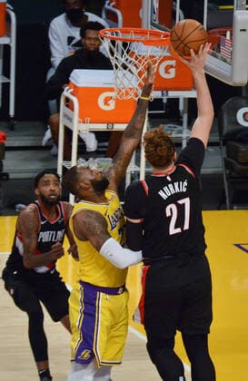 Portland Trail Blazers Jusuf Nurkic scores over Los Angeles Lakers LeBron James during the second half at Staples Center in Los Angeles on Monday, December 28, 2020. The Trail Blazers defeated the Lakers 115-107.  LAP2020122810 JIMxRUYMEN
