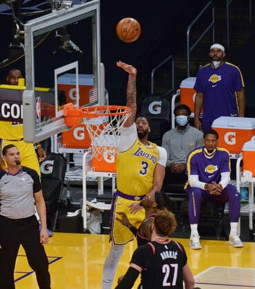 Los Angeles Lakers Dennis Schroder scores over Portland Trail Blazers Jusuf Nurkic during the second half at Staples Center in Los Angeles on Monday, December 28, 2020. The Trail Blazers defeated the Lakers 115-107.  LAP2020122816 JIMxRUYMEN