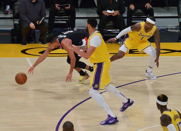 Portland Trail Blazers CJ McCollum chases after the loose ball as Los Angeles Lakers look on during the second half at Staples Center in Los Angeles on Monday, December 28, 2020. The Trail Blazers defeated the Lakers 115-107.  LAP2020122809 JIMxRUYMEN