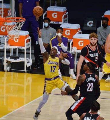Los Angeles Lakers Dennis Schroder scores past Portland Trail Blazers Robert Covington during the second half at Staples Center in Los Angeles on Monday, December 28, 2020. The Trail Blazers defeated the Lakers 115-107.  LAP2020122814 JIMxRUYMEN