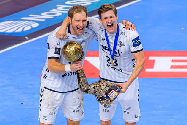 Cologne, Germany 29 December 2020 Handball CL Final4 19 20 Final THW Kiel vs FC Barcelona Steffen Weinhold THW Kiel , Rune Dahmke THW Kiel with the trophy Cologne Lanxess Arena North Rhine Westphalia Germany.