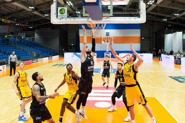 BARMER 2 Basketball Bundesliga ProA season 2020 2021 early game of the 23 match day on 30 12 2020 between Science City Jena vs Tigers Tübingen center Julius Wolf Jena rebounding against left Daniel Keppeler Tübingen Sparkassen Arena