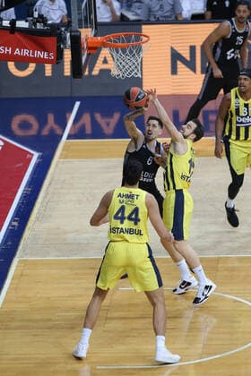 Melih Mahmutoglu , Ahmet Duverioglu of Fenerbahce Beko Istanbul and Paul Lacombe 6 of LDLC Asvel Villeurbanne during the Euroleague Basketball match between Fenerbahce Beko Istanbul and LDLC Asvel Villeurbanne at Ulker Dome n Istanbul , Turkey on December 30 , 2020. 