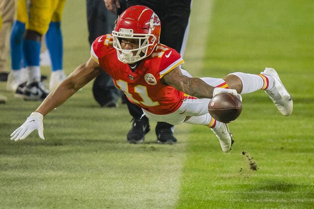 Kansas City Chiefs wide receiver Demarcus Robinson (11) leaps at the first down marker against the Los Angeles Chargers in the third quarter at Arrowhead Stadium in Kansas City on Sunday, January 03, 2021.  KCP20210123118 KYLExRIVAS