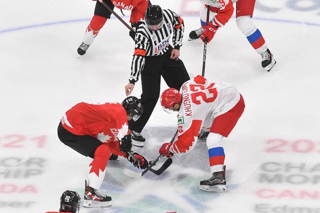 210105 Marat Khusnutdinov of Russia and Connor McMichael of Canada take the opening face off of the 2021 IIHF World Junior Championship semifinal between Canada and Russia on January 4, 2021 in Edmonton Photo Andy Devlin BILDBYRAN COP 306 AD0008 bbeng ishockey ice hockey jvm junior vm u20 2021 iihf world junior championship world juniors semifinal canada kanada russia ryssland,  Copyright: ANDYxDEVLIN BB210105BB017