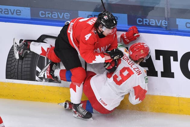 210105 Bowen Byram of Canada knocks Vasili Podkolzin of Russia to the ice during the 2021 IIHF World Junior Championship semifinal between Canada and Russia on January 4, 2021 in Edmonton Photo Andy Devlin BILDBYRAN COP 306 AD0008 bbeng ishockey ice hockey jvm junior vm u20 2021 iihf world junior championship world juniors semifinal canada kanada russia ryssland,  Copyright: ANDYxDEVLIN BB210105BB021