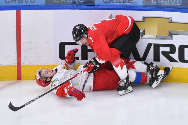 210105 Braden Schneider of Canada checks Mikhail Abramov of Russia to the ice during the 2021 IIHF World Junior Championship semifinal between Canada and Russia on January 4, 2021 in Edmonton Photo Andy Devlin BILDBYRAN COP 306 AD0008 bbeng ishockey ice hockey jvm junior vm u20 2021 iihf world junior championship world juniors semifinal canada kanada russia ryssland,  Copyright: ANDYxDEVLIN BB210105BB071