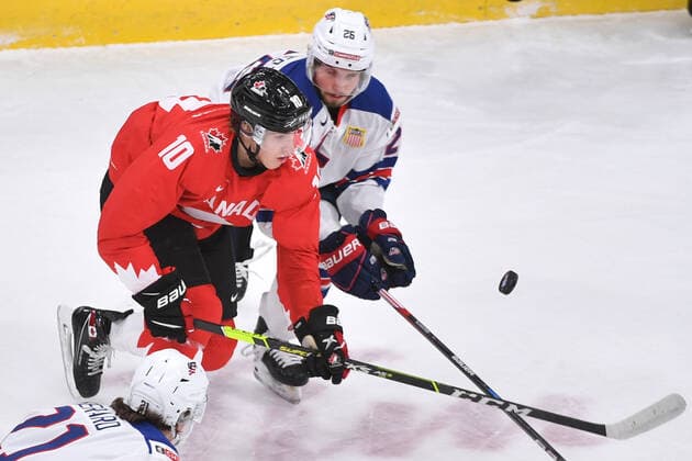 210106 Dylan Holloway of Canada and Landon Slaggert of USA battle for the puck during the 2021 IIHF World Junior Championship final between USA and Canada on January 6, 2021 in Edmonton Photo Andy Devlin BILDBYRAN COP 306 AD0012 bbeng ishockey ice hockey jvm junior vm u20 2021 iihf world junior championship world juniors final usa canada kanada,  Copyright: ANDYxDEVLIN BB210106BB049