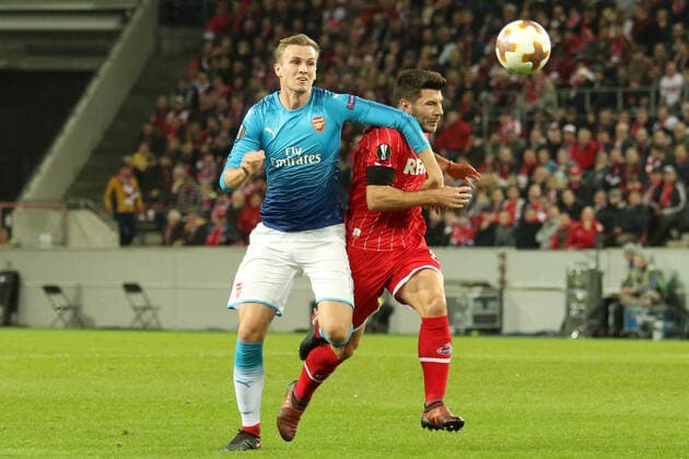 Koeln, Germany 23 November 2017 EL 17 18 1 FC Koeln vs FC Arsenal v li in duel Per Mertesacker Arsenal and Milos Jojic Koeln EL 17 18 1 FC Koeln vs FC Arsenal swun
