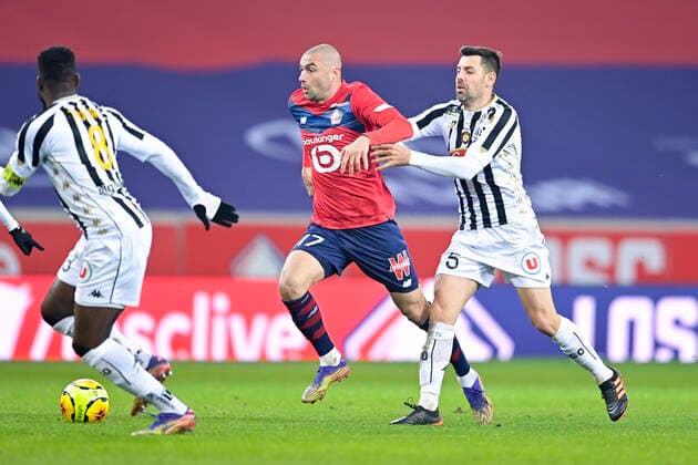 Burak Yilmaz (Losc) vs Thomas Mangani (Angers) FOOTBALL : LOSC vs Angers - Ligue1 Uber eats - 06 01 2021 JBAutissier Panoramic 