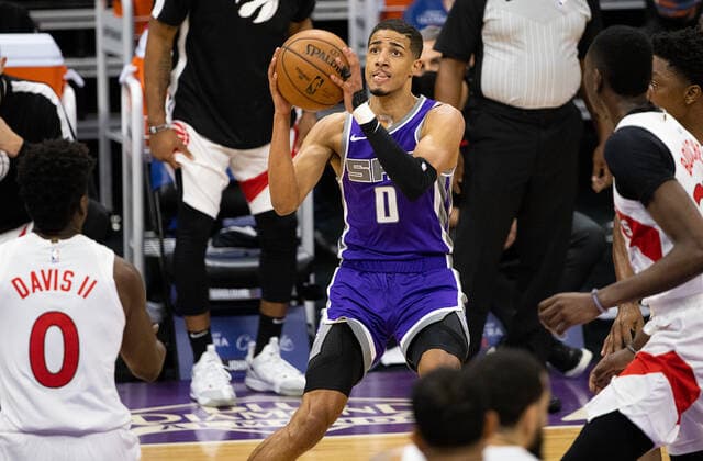 January 8, 2021, Sacramento, CA, USA: Sacramento Kings guard Tyrese Haliburton (0) looks for an opening guarded by Toronto Raptors guard Terence Davis (0) during a game at the Golden 1 Center on Friday, Jan 8, 2021 in Sacramento. Sacramento USA - ZUMAj89_ 20210108_zaf_j89_012 Copyright: xPaulxKitagakixJr.x