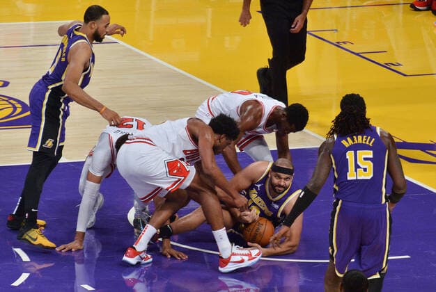 Los Angeles Lakers Jared Dudley takes control of the loose ball surrounded by Chicago Bulls defenders during the fourth quarter at Staples Center in Los Angeles on Friday, January 8, 2021. The Lakers defeated the Bulls 117-115.  LAP2021010811 JIMxRUYMEN