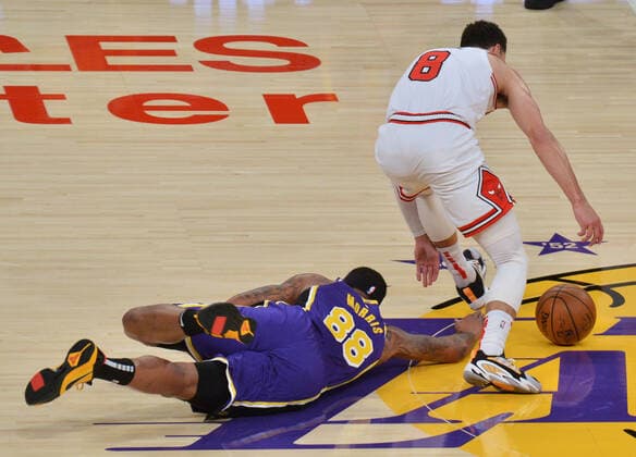 Los Angeles Lakers Markieff Morris falls to the floor as he tries to steal the ball away from Chicago Bulls Zach Lavine during the fourth quarter at Staples Center in Los Angeles on Friday, January 8, 2021. The Lakers defeated the Bulls 117-115.  LAP2021010821 JIMxRUYMEN
