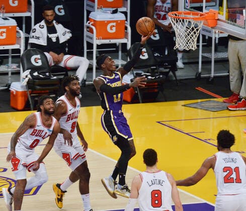 Los Angeles Lakers Dennis Schroder scores past Chicago Bulls defenders on a layup during second quarter action at Staples Center in Los Angeles on Friday, January 8, 2021. The Lakers defeated the Bulls 117-115.  LAP2021010825 JIMxRUYMEN