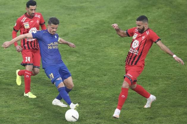 Tehran, Iran, Jan 11st Voria Ghafouri (left) and Ahmad Noorolahi (right) during the 2020 21 Persian Gulf Pro League between Esteghlal and Perspolis at Azadi Stadium in Tehran, Iran. Alireza Zeinali SPP IRN: Esteghlal - Perspolis, 11.01.2021 