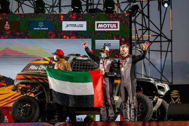 386 Al Helei Mansour (are), Orr Michael (gbr), PH Abu Dhabi Racing, Light Weight Vehicles Prototype - T3, portrait during the finishing podium ceremony at the King Abdullah International Stadium in Jeddah, in Saudi Arabia on January 15, 2021 AUTOMOBILE : DAKAR 2021 - Arabie saoudite - Podiums - 15 01 2021 DPPI Panoramic 
