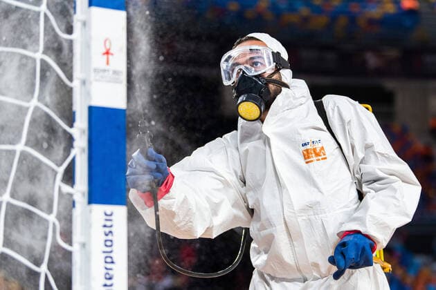 210116 A person in protective gear disinfects a goalpost, due to the coronavirus covid 19 pandemic, ahead of the 2021 IHF World Handball Championship match between Chile and Sweden on January 16, 2021 in Cairo Photo Mathias Bergeld BILDBYRAN COP 200 MB0090 handball handboll handball chile sweden sverige bbeng vm handball vm handbolls vm ihf handball world championship world handball championship 2021 world championship 2021 covid 19 coronavirus coronaviruset,  Copyright: MATHIASxBERGELD BB210116MB166