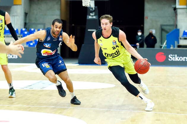 13 Matchday of the easyCredit BBL Basketball Bundesliga at the Arena Hohenlohe in Ilshofen Season 2020 2021 HAKRO Merlins Crailsheim vs Medi Bayreuth Elias Lasisi HAKRO Merlins Crailsheim 6 left David Walker Medi Bayreuth23 right