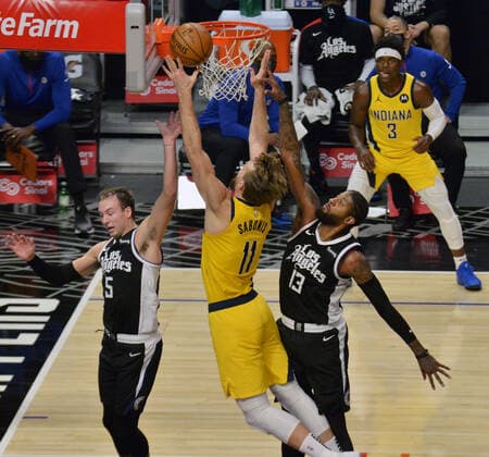 Basketball, NBA, Los Angeles Clippers - Indiana Pacers Indiana Pacers power forward Domantas Sabonis is fouled by Los Angeles Clippers forward Paul George during the fourth quarter at Staples Center in Los Angeles on Sunday, January 17, 2021. The Clippers defeated the short-handed Pacers 129-96.  LAP2021011707 JIMxRUYMEN
