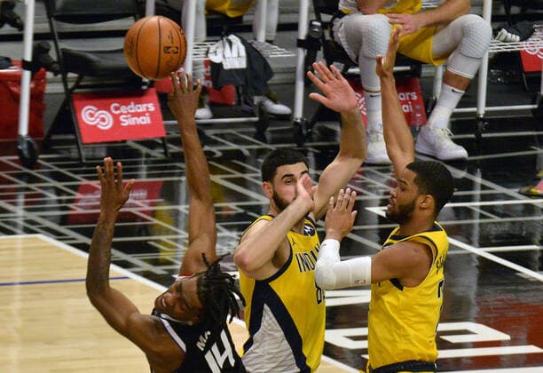 Basketball, NBA, Los Angeles Clippers - Indiana Pacers Los Angeles Clippers forward Terrance Mann loses the ball as he is fouled by Indiana Pacers center Goga Bitadze on his way to the basket during the fourth quarter at Staples Center in Los Angeles on Sunday, January 17, 2021. The Clippers defeated the short-handed Pacers 129-96.  LAP2021011709 JIMxRUYMEN