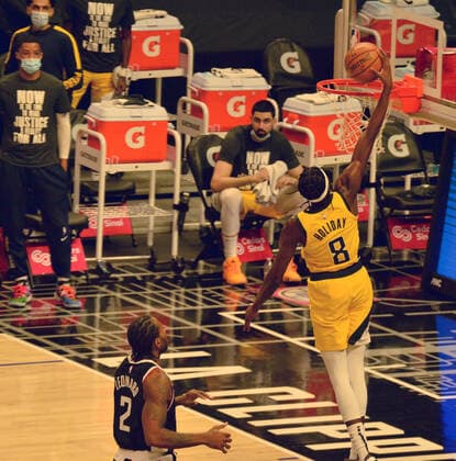 Indiana Pacers guard Justin Holiday scores after stealing the ball from Los Angeles Clippers forward Kawhi Leonard during the fourth quarter at Staples Center in Los Angeles on Sunday, January 17, 2021. The Clippers defeated the short-handed Pacers 129-96.  LAP2021011714 JIMxRUYMEN
