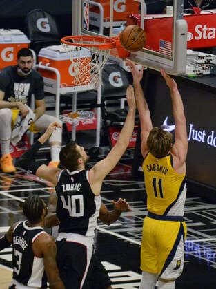 Indiana Pacers power forward Domantas Sabonis is fouled by Los Angeles Clippers Ivica Zuboc during the fourth quarter at Staples Center in Los Angeles on Sunday, January 17, 2021. The Clippers defeated the short-handed Pacers 129-96.  LAP2021011720 JIMxRUYMEN