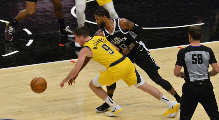 Indiana Pacers point guard T.J. McConnell steals the ball fromLos Angeles Clippers forward Paul George during the fourth quarter at Staples Center in Los Angeles on Sunday, January 17, 2021. The Clippers defeated the short-handed Pacers 129-96.  LAP2021011721 JIMxRUYMEN