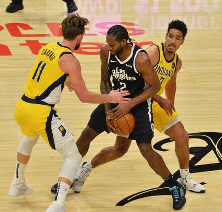 Los Angeles Clippers forward Kawhi Leonard controls the ball as he is double teamed by Indiana Pacers Domantas Sabonis and Malcolm Brogdon during the second quarter at Staples Center in Los Angeles on Sunday, January 17, 2021. The Clippers defeated the short-handed Pacers 129-96.  LAP2021011724 JIMxRUYMEN