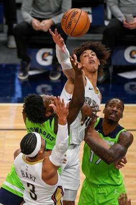 Minnesota Timberwolves guard Anthony Edwards (L) shot is blocked by New Orleans Pelicans center Jaxson Hayes (C) as Minnesota Timberwolves center Ed Davis (17) and New Orleans Pelicans guard Josh Hart (3) try for the rebound during the first half of their NBA, Basketball Herren, USA basketball game between the New Orleans Pelicans and the Minnesota Timberwolves at Target Center in Minneapolis, Minnesota, USA, 23 January, 2021. New Orleans Pelicans - Minnesota Timberwolves !ACHTUNG: NUR REDAKTIONELLE NUTZUNG!  Copyright: xCRAIGxLASSIGx AME1077 20210124-637470641925201011