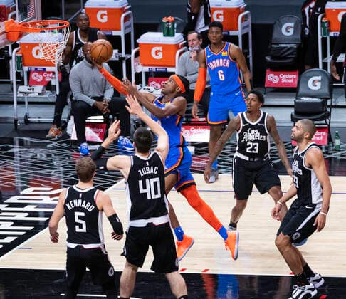 LOS ANGELES, CA - JANUARY 24: Oklahoma City Thunder Guard Shai Gilgeous-Alexander (2) takes the ball to the net over Los Angeles Clippers Center Ivica Zubac (40) during an NBA, Basketball Herren, USA game between the Los Angeles Clippers and the Oklahoma City Thunder and the on January 24, 2021 at STAPLES Center in Los Angeles, CA. (Photo by Carrie Giordano Icon Sportswire) NBA: JAN 24 Thunder at Clippers Icon210124007