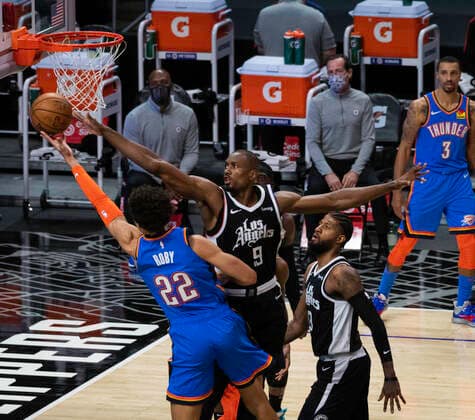 LOS ANGELES, CA - JANUARY 24: Los Angeles Clippers Center Serge Ibaka (9) and Oklahoma City Thunder Center Isaiah Roby (22) both reach for the rebound during an NBA, Basketball Herren, USA game between the Los Angeles Clippers and the Oklahoma City Thunder and the on January 24, 2021 at STAPLES Center in Los Angeles, CA. (Photo by Carrie Giordano Icon Sportswire) NBA: JAN 24 Thunder at Clippers Icon210124011