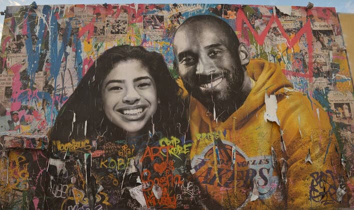 A mural honoring Kobe Bryant and his daughter Gianna Bryant is seen on Monday, January 25, 2021 in Los Angeles. One day ahead of the anniversary of the Calabasas helicopter crash that killed the Laker legend, his 13-year-old daughter and seven others, Sen. Dianne Feinstein (D-CA) and Rep. Brad Sherman (D-CA) announced a bill Tuesday that would require Terrain Avoidance Warning Systems on all helicopters carrying six or more passengers.  LAP2021012502 JIMxRUYMEN