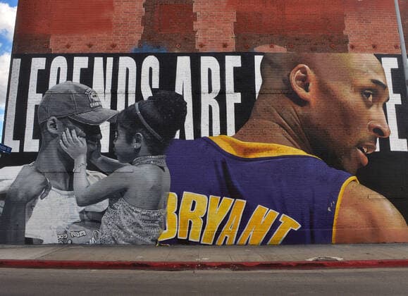 A mural honoring Kobe Bryant and his daughter Gianna Bryant is seen on Monday, January 25, 2021 in Los Angeles. One day ahead of the anniversary of the Calabasas helicopter crash that killed the Laker legend, his 13-year-old daughter and seven others, Sen. Dianne Feinstein (D-CA) and Rep. Brad Sherman (D-CA) announced a bill Tuesday that would require Terrain Avoidance Warning Systems on all helicopters carrying six or more passengers.  LAP2021012506 JIMxRUYMEN