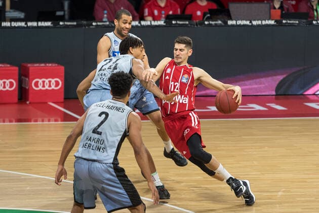 Basketball, BBL, 20210131, FC Bayern Munich Merlins Crailsheim Pictured Jeremy JONES Merlins Crailsheim, 24 defends Diego FLACCADORI FC Bayern Munich, 12 runs on cant get through Munich Audi Dome Bayern Germany Copyright: Passion2Press MarkusxFischerx