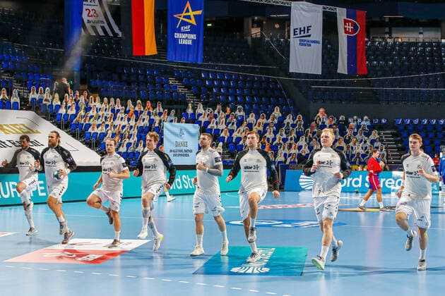 In picture Team THW Kiel warming up EHF Handball Champions League, THW Kiel vs HC Motor Zaporozhye, 4 2 2021, Kiel Wunderino Arena , Germany