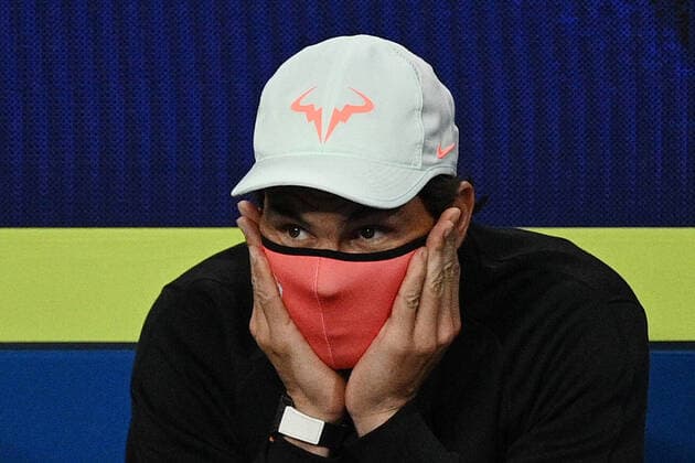 Sport Bilder des Tages TENNIS ATP, Tennis Herren CUP, Rafael Nadal of Team Spain wears his face mask as he watches team mate Pablo Carreno Busta play Fabio Fignini of Italy during the semi-finals of the ATP Cup at Melbourne Park in Melbourne, Saturday, February 6, 2021. ( NO ARCHIVING, EDITORIAL USE ONLY, NO USE IN BOOKS WITHOUT CONSENT MELBOURNE VIC AUSTRALIA  Copyright: xDEANxLEWINSx 20210206001518620746