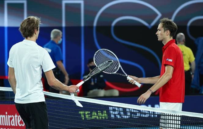 (210206) -- MELBOURNE, Feb. 6, 2021 -- Alexander Zverev (L) of Germany and Daniil Medvedev of Russia touch their racquets after their ATP, Tennis Herren Cup semifinal match between Russia and Germany in Melbourne Park, in Melbourne, Australia, on Feb. 6, 2021. ) (SP)AUSTRALIA-MELBOURNE-TENNIS-ATP CUP-RUSSIA VS GERMANY BaixXuefei 
