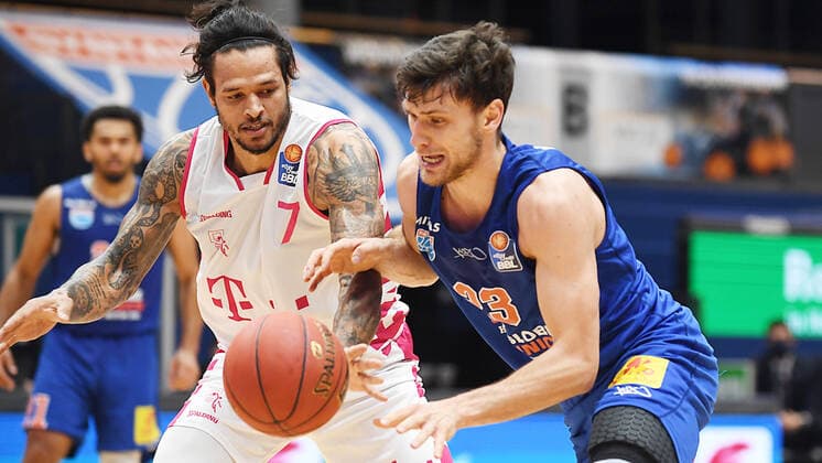 Basketball 1 Bundesliga, Season 2020 2021, 17 Matchday, Syntainics MBC Weissenfels vs Telekom Baskets Bonn 06 02 2021 Duel for the ball between Michal Michalak MBC Weissenfels, backnumber 23 right and Chris Babb Guard Bonn, backnumber 7 left during the match MBC Weissenfels vs Bonn 06 02 2021 Weissenfels Saxony Anhalt Germany Stadthalle Weissenfels