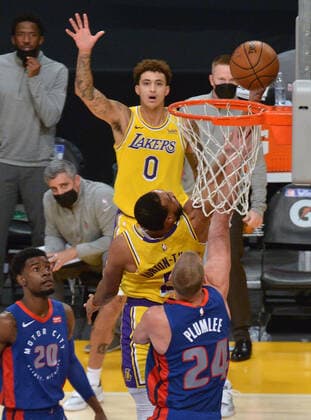 Los Angeles Lakers guard Talen Horton-Tucker is fouled by Detroit Pistons center Mason Plumleer as scores on a reverse layup during the third quarter at Staples Center in Los Angeles on Saturday, February 6, 2021. The Lakers defeated the Pistons 135-129 in double-overtime.  LAP2021020619 JIMxRUYMEN