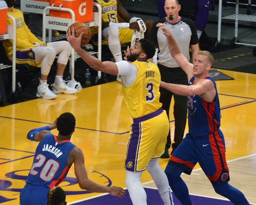 Los Angeles Lakers forward Anthony Davis secures the offensive foul against Detroit Pistons center Mason Plumlee during the second quarter at Staples Center in Los Angeles on Saturday, February 6, 2021. The Lakers defeated the Pistons 135-129 in double-overtime.  LAP2021020636 JIMxRUYMEN