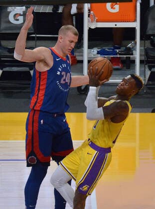 Los Angeles Lakers point guard KDennis Schroder goes up against Detroit Pistons center Mason Plumlee during the second quarter at Staples Center in Los Angeles on Saturday, February 6, 2021. The Lakers defeated the Pistons 135-129 in double-overtime.  LAP2021020637 JIMxRUYMEN