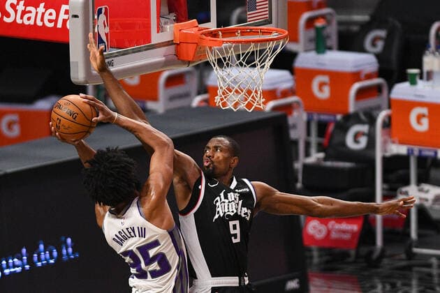 Sport Bilder des Tages LOS ANGELES, CA - FEBRUARY 07: Los Angeles Clippers Center Serge Ibaka (9) challenges Sacramento Kings Forward Marvin Bagley III (35) shot during a NBA, Basketball Herren, USA game between the Sacramento Kings and the Los Angeles Clippers on February 7, 2021 at STAPLES Center in Los Angeles, CA. The game was played without fans due to the COVID-19 pandemic. (Photo by Brian Rothmuller Icon Sportswire) NBA: FEB 07 Kings at Clippers Icon210207001