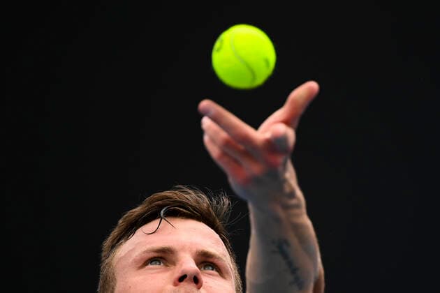 TENNIS AUSTRALIAN OPEN, Marton Fucsovics of Hungary in action during his first Round Men s singles match against Marc Polmans of Australia on Day 1 of the Australian Open at Melbourne Park in Melbourne, Monday, February 8, 2021. ( NO ARCHIVING, EDITORIAL USE ONLY, NO USE IN BOOKS WITHOUT CONSENT MELBOURNE VIC AUSTRALIA  Copyright: xDAVExHUNTx 20210208001519126026