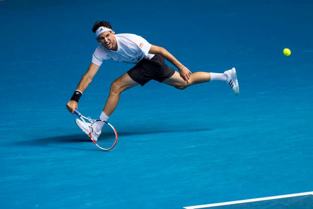 MELBOURNE, VIC - FEBRUARY 08: Dominic Thiem of Austria returns the ball during round 1 of the 2021 Australian Open on February 8 2020, at Melbourne Park in Melbourne, Australia. (Photo by Jason Heidrich Icon Sportswire) TENNIS: FEB 08 Australian Open Icon2102081301